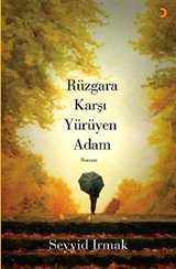 Rüzgara Karşı Yürüyen Adam